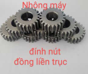 Nhông máy đính nút đồng liền trục.